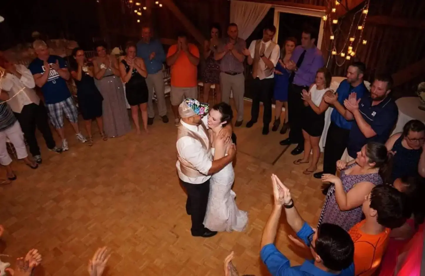 Bride and groom dancing by marquee light letters at an Abilene wedding reception